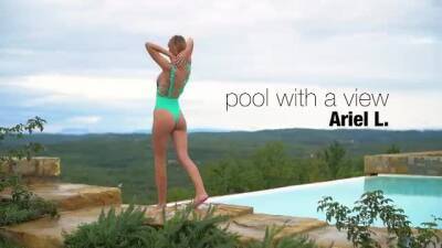 Lovely girl has a swimming pool with an amazing view, and likes posing nude next to it on freefilmz.com