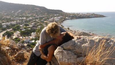 Beautiful Teen Couple In Love Passionately Kissing Above The Sea On Crete Island on freefilmz.com