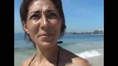 Tanned cougar was picked up on a public beach for kinky sex and a facial - Germany - Brazil on freefilmz.com