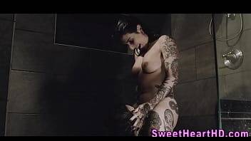 Inked les milf eaten out in the shower on freefilmz.com