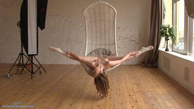 Flexible Beauty Ballerina Playfully Poses For Me In A Hanging Chair, Moving Her Long Legs Wide. 4 Of 6 on freefilmz.com