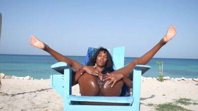 Ebony Latin Girl, Oil Skin And Public Orgasm On The Beach on freefilmz.com