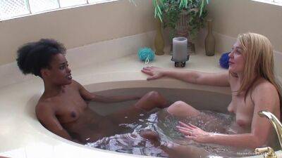 Ebony lesbian and her blonde girlfriend fuck in the tub on freefilmz.com