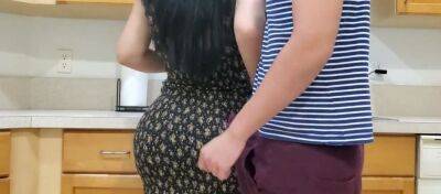 Voluptuous mommy is banged by her randy stepson in the kitchen while making dinner on freefilmz.com