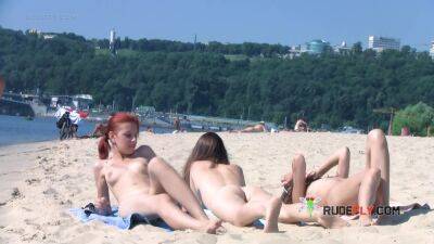 Wicked young nudist enjoys being topless at the beach on freefilmz.com