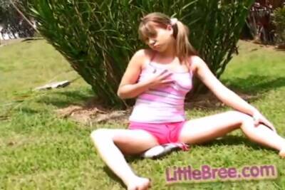 Petite Teen Strips Off Outdoors On The Grass on freefilmz.com