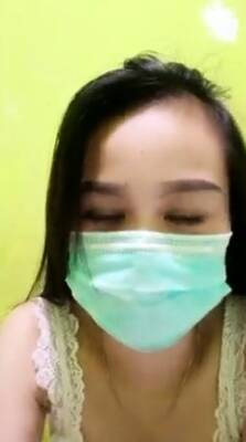 Playful Indonesian hottie wears a facemask while rubbing - Indonesia on freefilmz.com