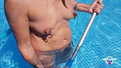 Nippleringlover Horny Milf Nude Cleaning The Pool Extreme Stretched Pierced Nipples on freefilmz.com