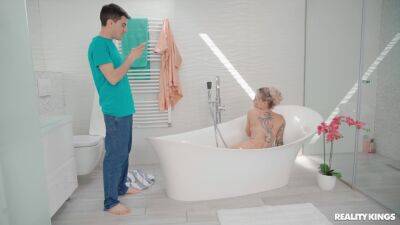Inked MILF welcomes horny stepson into the tub for some sex fun on freefilmz.com