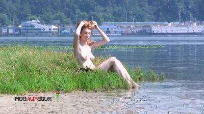 Playful blond nudist teen caught on camera naked at the beach on freefilmz.com