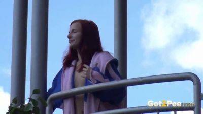 Watch this kinky redhead get a public surprise while peeing in the city on freefilmz.com