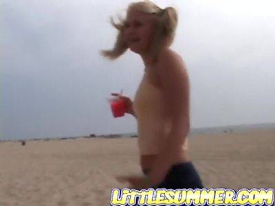 Petite teen masturbating on the beach on freefilmz.com