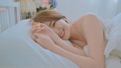 Good morning with young and beautiful Korean woman basking in bed - North Korea on freefilmz.com