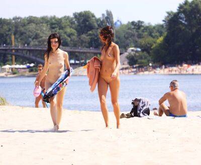 Petite nudist teen enjoys a beautiful day at the beach on freefilmz.com