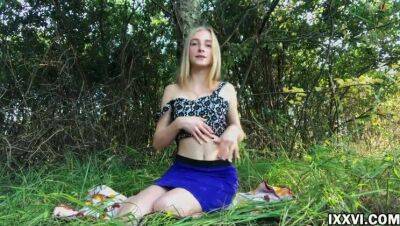 Beautiful young girl outdoor masturbating her pussy in the woods in a clearing on freefilmz.com