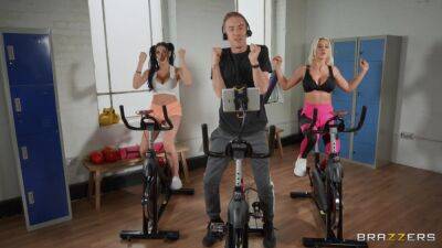 Sporty bitches get intimate during spinning class and devour the same cock together on freefilmz.com