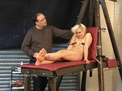 Busty blonde is punished with hot wax and hard spanking on freefilmz.com