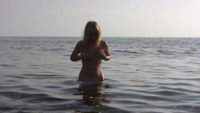 Divine Blonde Teen Blissfully Naked in the Sea on freefilmz.com
