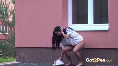 Brunette hottie pees in public while getting her shaved pussy soaked - Czech Republic on freefilmz.com