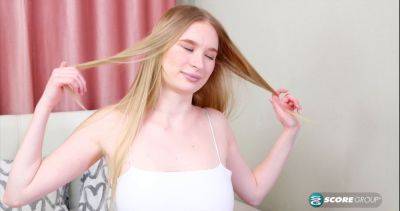 Asya, the blonde teen, spreads her legs wide open and toys her shaved cunt with a massive dildo on freefilmz.com