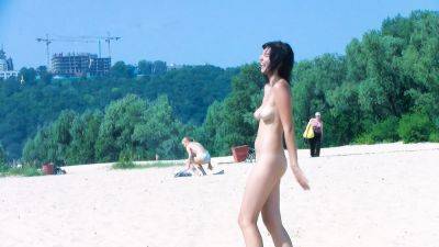 Hot nudist teen filmed by voyeur as she sits naked outside on freefilmz.com