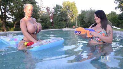 Floating Gazongas: Two British Bombshells With Big Tits In The Pool - Britain on freefilmz.com